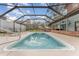 Sparkling clean pool with a screened enclosure at 3515 Crestwood St, Lakeland, FL 33812