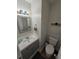 Updated bathroom with gray vanity and white toilet at 820 W 25Th St, Sanford, FL 32771