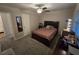 Bright bedroom with a double bed and ceiling fan at 820 W 25Th St, Sanford, FL 32771