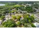 Aerial view of neighborhood featuring many trees, homes, and neighborhood streets at 1412 E Main St, Lakeland, FL 33801