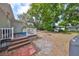 Backyard with deck, firepit, and grassy area, perfect for outdoor living at 1412 E Main St, Lakeland, FL 33801