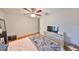 Bedroom features hardwood floors, ceiling fan, and dresser at 1412 E Main St, Lakeland, FL 33801
