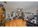 Spacious bedroom featuring hardwood floors, ceiling fan and collectibles display at 1412 E Main St, Lakeland, FL 33801