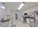 Bright kitchen with stainless steel appliances, granite countertops, and white cabinets at 1412 E Main St, Lakeland, FL 33801