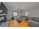 Cozy living room showcasing hardwood floors, neutral paint, stylish furnishings, and a decorative fireplace at 1412 E Main St, Lakeland, FL 33801