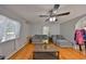 Inviting living room with hardwood floors, soft gray furniture, and large windows for natural light at 1412 E Main St, Lakeland, FL 33801