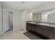Bathroom featuring double sinks, granite countertops, and tile flooring at 2133 Old Mining Rd, Lakeland, FL 33801