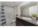 Bathroom featuring a tub with a shower, a toilet, tile floors, and a vanity with a granite countertop and a sink at 2133 Old Mining Rd, Lakeland, FL 33801