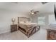 Spacious bedroom featuring a ceiling fan, natural light, and neutral tones at 2133 Old Mining Rd, Lakeland, FL 33801