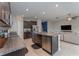 Modern kitchen featuring stainless steel appliances, granite countertops, and a large island at 2133 Old Mining Rd, Lakeland, FL 33801