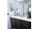 Bathroom with a vanity, dark brown cabinets, and a marble countertop at 4035 Solamor St, Lakeland, FL 33810