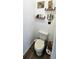 Small bathroom with toilet and floating shelves at 4035 Solamor St, Lakeland, FL 33810
