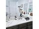 Bathroom featuring a large mirror and a spacious vanity with a modern countertop at 4035 Solamor St, Lakeland, FL 33810