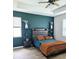 Spacious bedroom with teal accent wall and modern furnishings at 4035 Solamor St, Lakeland, FL 33810