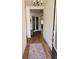 Bright entryway with wood-look tile floors and a world map rug at 4035 Solamor St, Lakeland, FL 33810