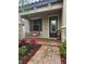 Inviting front porch with brick flooring and a cozy porch swing at 4035 Solamor St, Lakeland, FL 33810