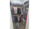 Spacious walk-in closet featuring ample shelving, hanging space and shoe racks at 4035 Solamor St, Lakeland, FL 33810