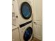Modern stackable washer and dryer in laundry room at 4035 Solamor St, Lakeland, FL 33810