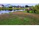 Large backyard with pond view and grassy area at 2912 Sweetspire Cir, Kissimmee, FL 34746
