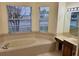 Relaxing bathroom with a jetted tub and double vanity at 2912 Sweetspire Cir, Kissimmee, FL 34746