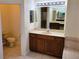 Bathroom with double sinks, large mirror, and separate shower and tub at 2912 Sweetspire Cir, Kissimmee, FL 34746