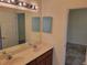 Double vanity bathroom with a view of another bedroom at 2912 Sweetspire Cir, Kissimmee, FL 34746