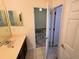 Bathroom with double vanity and access to bedroom at 2912 Sweetspire Cir, Kissimmee, FL 34746