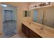 Double vanity bathroom with a view of bedroom and closet at 2912 Sweetspire Cir, Kissimmee, FL 34746