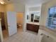 Spacious bathroom with a garden tub, double vanity, and toilet at 2912 Sweetspire Cir, Kissimmee, FL 34746