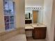 Bathroom with double sinks, large mirror, and a soaking tub at 2912 Sweetspire Cir, Kissimmee, FL 34746