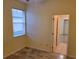 Bedroom with a window and access to the bathroom at 2912 Sweetspire Cir, Kissimmee, FL 34746
