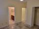 Bedroom with tile floors and access to bathroom at 2912 Sweetspire Cir, Kissimmee, FL 34746
