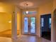 Bright and airy entryway with double doors and tile flooring at 2912 Sweetspire Cir, Kissimmee, FL 34746