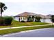 One-story house with a three-car garage and palm trees at 2912 Sweetspire Cir, Kissimmee, FL 34746