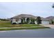 One-story house with two-car garage and manicured lawn at 2912 Sweetspire Cir, Kissimmee, FL 34746