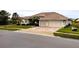 Two-story house with two-car garage and manicured lawn at 2912 Sweetspire Cir, Kissimmee, FL 34746