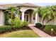 Inviting front entrance with double doors and lush landscaping at 2912 Sweetspire Cir, Kissimmee, FL 34746