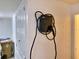 Wall mounted electric car charger in garage at 2912 Sweetspire Cir, Kissimmee, FL 34746