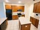 Kitchen features wood cabinets, stainless steel appliances, and an island at 2912 Sweetspire Cir, Kissimmee, FL 34746
