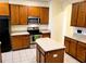Eat-in kitchen with island and ample cabinet space at 2912 Sweetspire Cir, Kissimmee, FL 34746