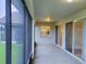Screened-in porch with backyard and pond view at 2912 Sweetspire Cir, Kissimmee, FL 34746