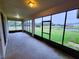 Spacious screened porch overlooking a pond and green space at 2912 Sweetspire Cir, Kissimmee, FL 34746