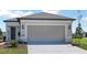 Charming single-story home with a large garage, well-manicured lawn, and tasteful landscaping at 5915 Sw 87Th Ave, Ocala, FL 34481
