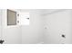 A utility room with a shelf, open compartment, and a door to a compact space at 5915 Sw 87Th Ave, Ocala, FL 34481