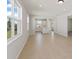 Open-concept living room boasts natural light, and seamless flow to the dining area and kitchen at 5915 Sw 87Th Ave, Ocala, FL 34481