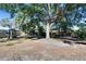 Large backyard with playset and mature trees at 613 4Th Ne St, Fort Meade, FL 33841