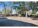 Large backyard with mature trees and patio at 613 4Th Ne St, Fort Meade, FL 33841