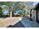 Large backyard with patio and mature trees at 613 4Th Ne St, Fort Meade, FL 33841