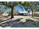 Spacious backyard with mature trees and home view at 613 4Th Ne St, Fort Meade, FL 33841