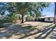 Spacious backyard with mature trees and home view at 613 4Th Ne St, Fort Meade, FL 33841
